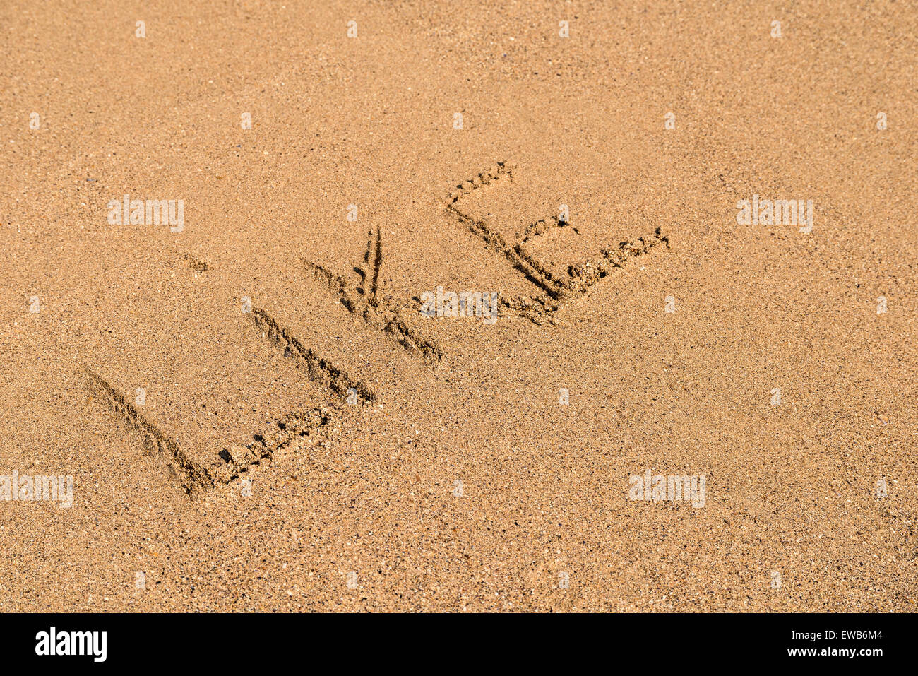 Come la parola scritta su estiva soleggiata spiaggia di sabbia Foto Stock