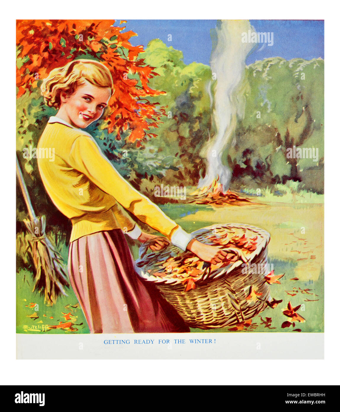Ragazza la raccolta di foglie di autunno nel suo cesto per il falò Foto Stock