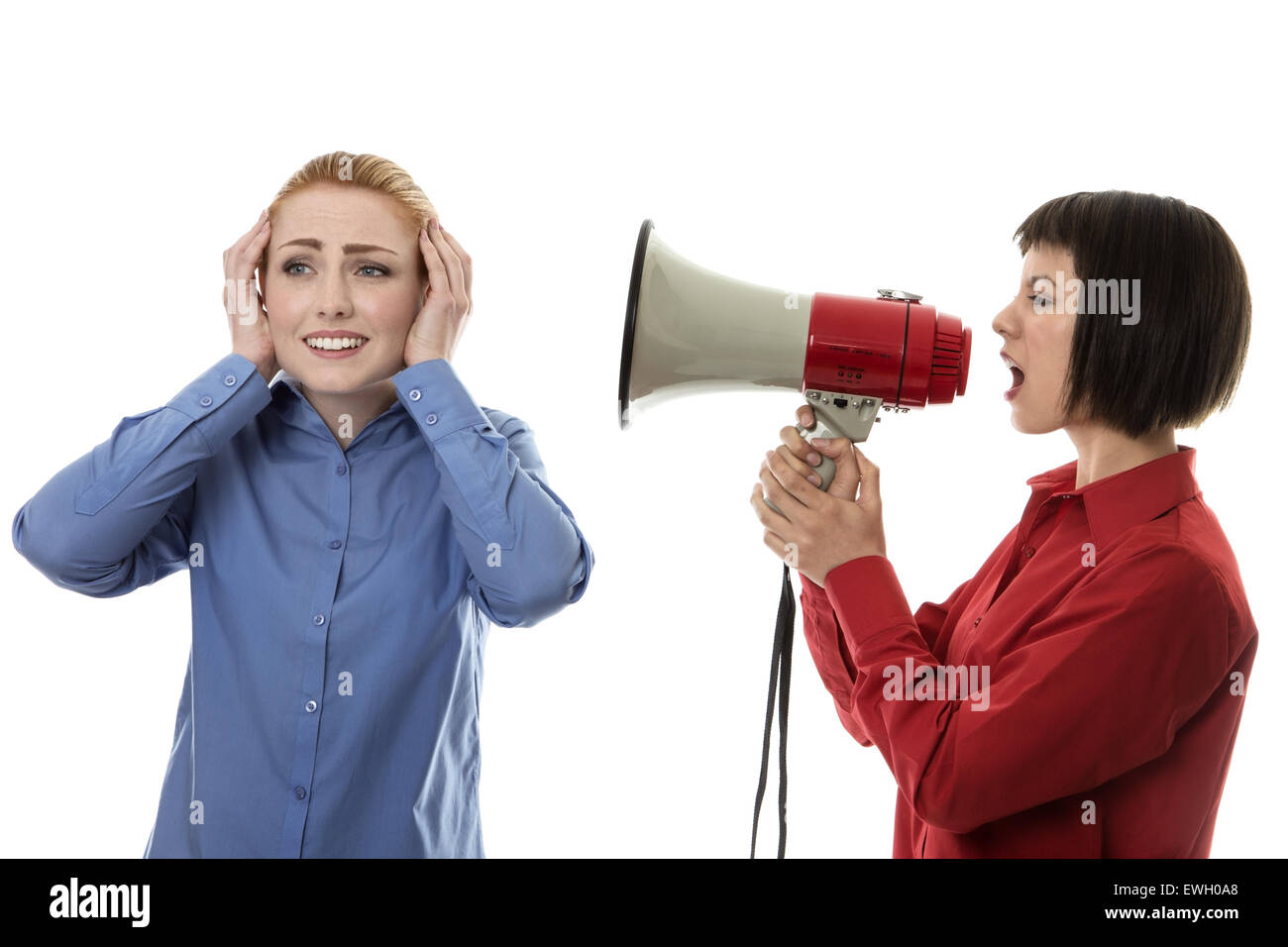 Imprenditrice grida di un'altra donna usando un bullhorn Foto Stock