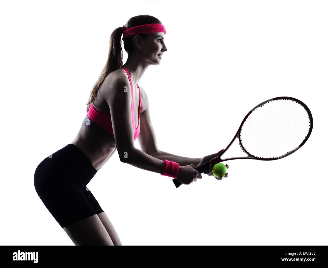 Una donna giocatore di tennis in studio silhouette isolati su sfondo bianco Foto Stock