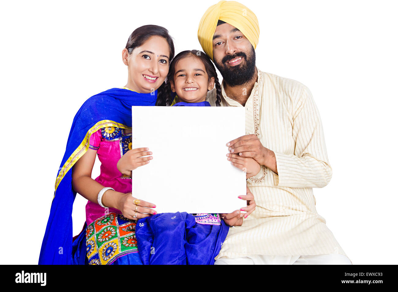 Indian Punjabi genitori e figlia che mostra la Bacheca Foto Stock