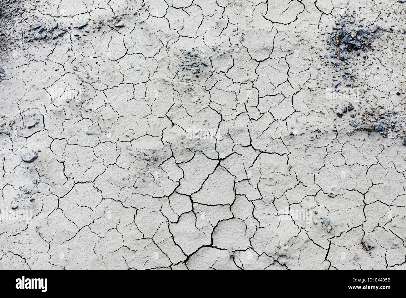 Pattern creato da una foto incrinato terra. Condizioni di tempo asciutto, la siccità. Foto Stock