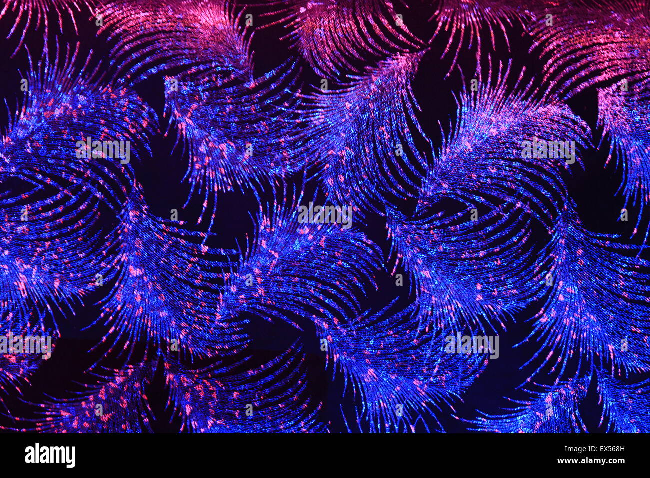 Sfondo fluorescente / arazzo in un nightclub greco. Atene. Foto Stock
