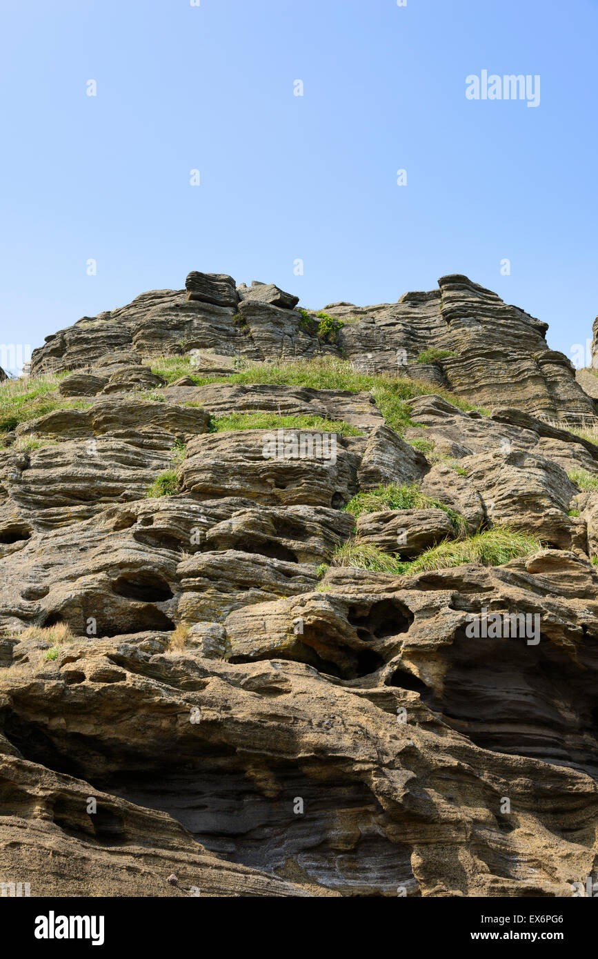 Yongmeori spiaggia di Jeju Island è famosa per il maestoso scenario da il mare e la riva del mare le scogliere di pietra arenaria. Foto Stock