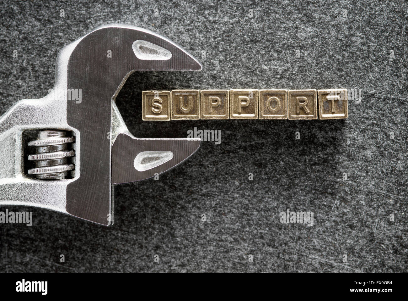 Parola di supporto costituito da tasselli metallici con chiave regolabile Foto Stock