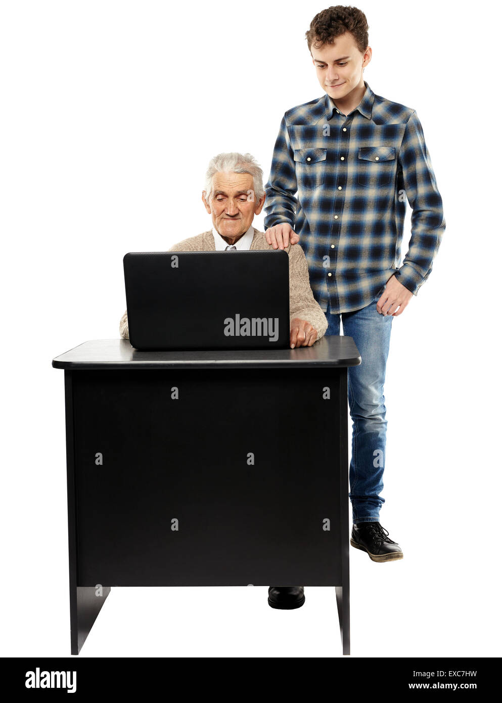 Ragazzo adolescente insegnamento suo nonno come utilizzare un computer Foto Stock