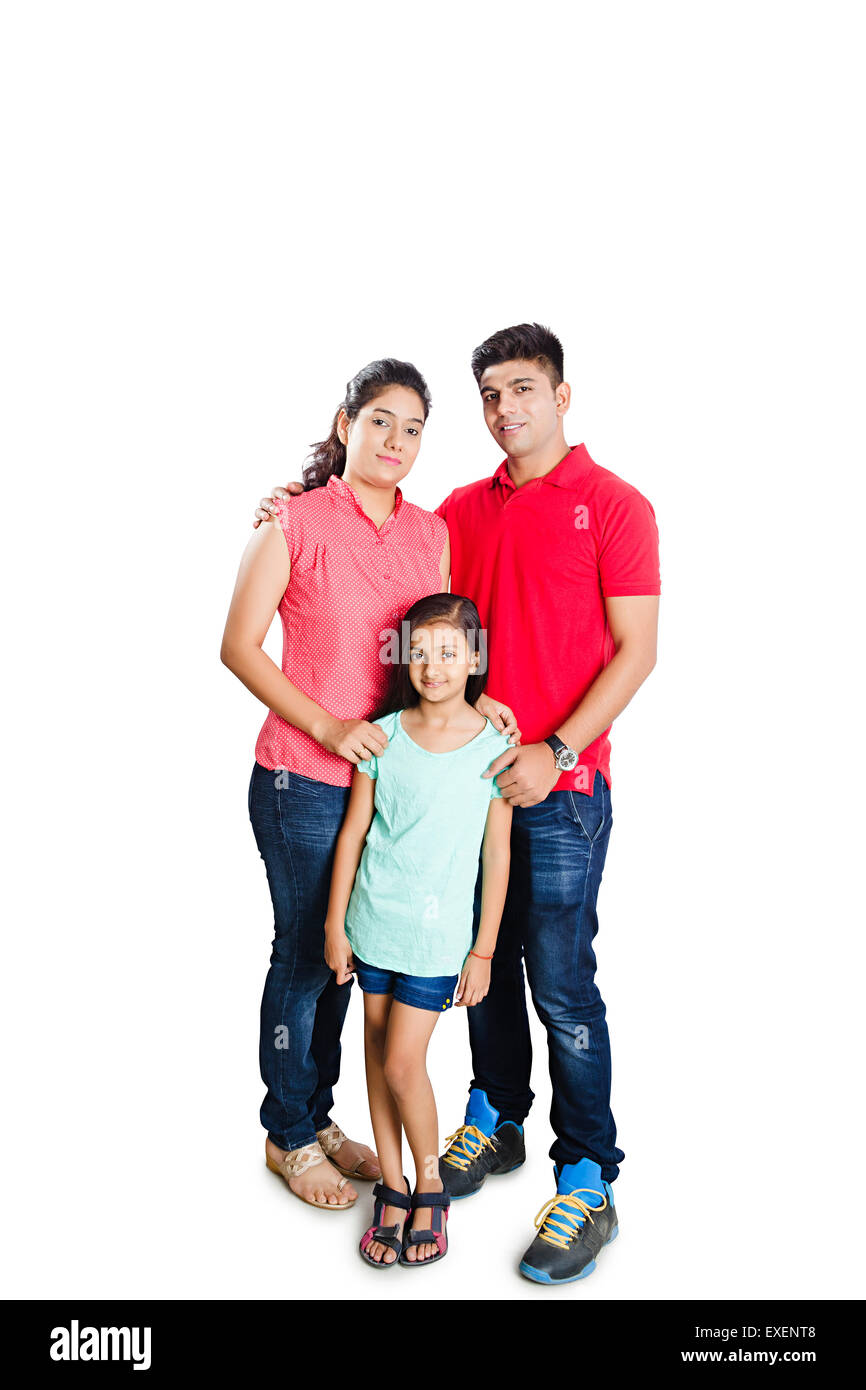 Indian genitori con figlia pongono permanente Foto Stock