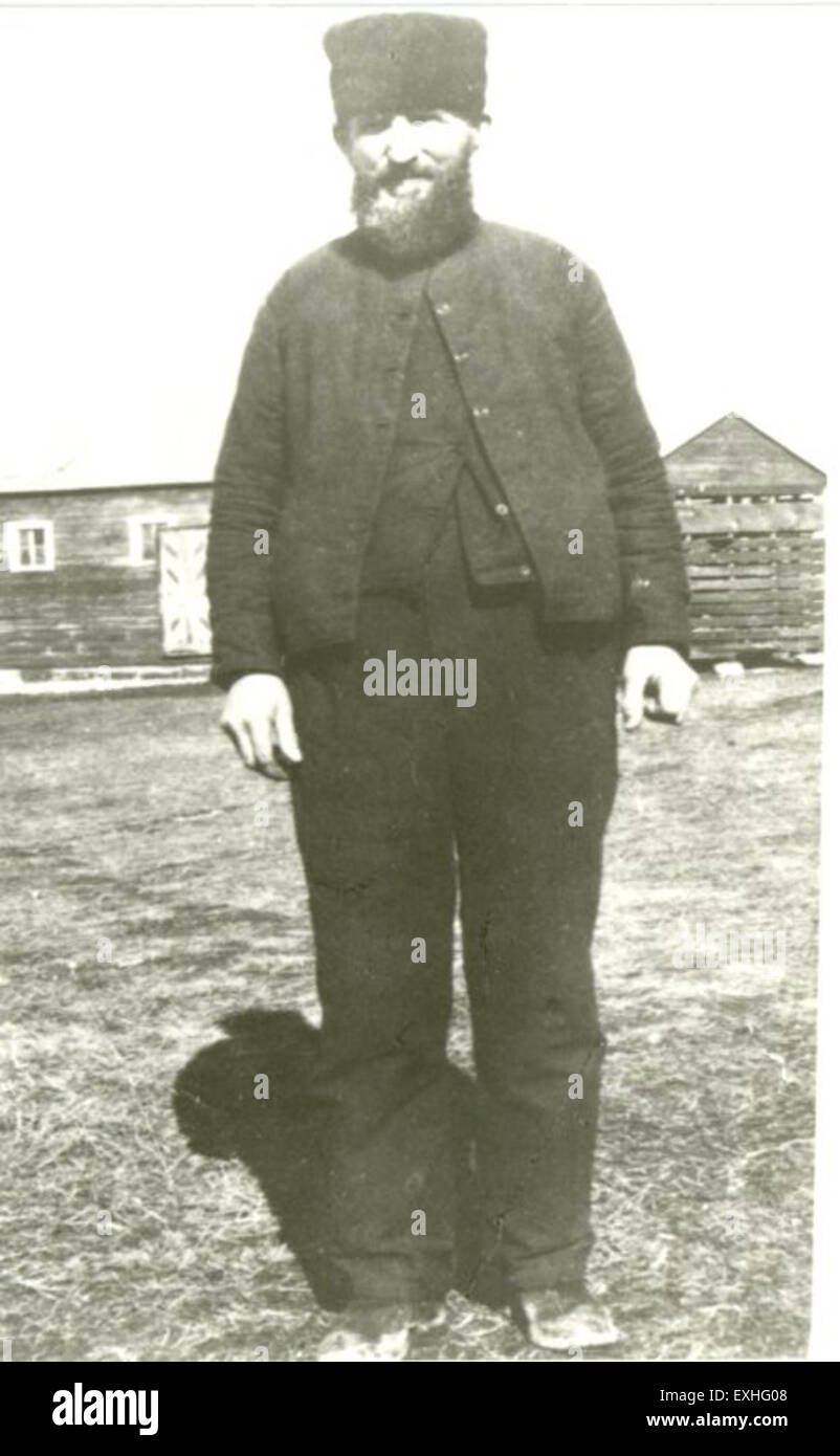 Una rappresentazione degli Hutteriti, una comunità religiosa anabattista, che cattura la loro identità culturale e il loro stile di vita. L'opera d'arte presenta membri della comunità hutterita, mettendo in evidenza le loro tradizioni, i loro abiti e la loro vita rurale. Il dipinto offre una visione approfondita della cultura e della storia hutterite. Foto Stock