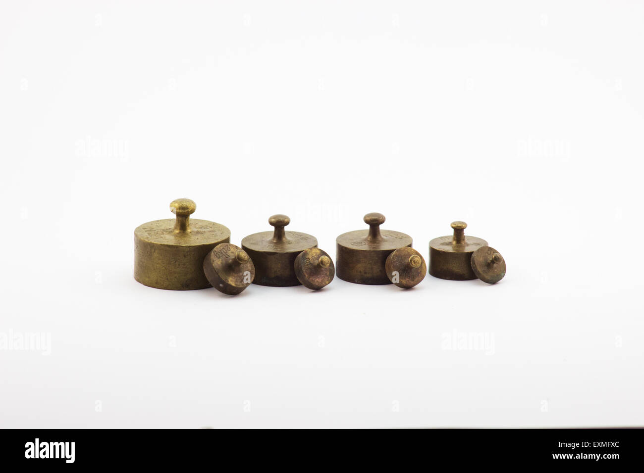 Piccole masse in ottone per bilancia Foto Stock