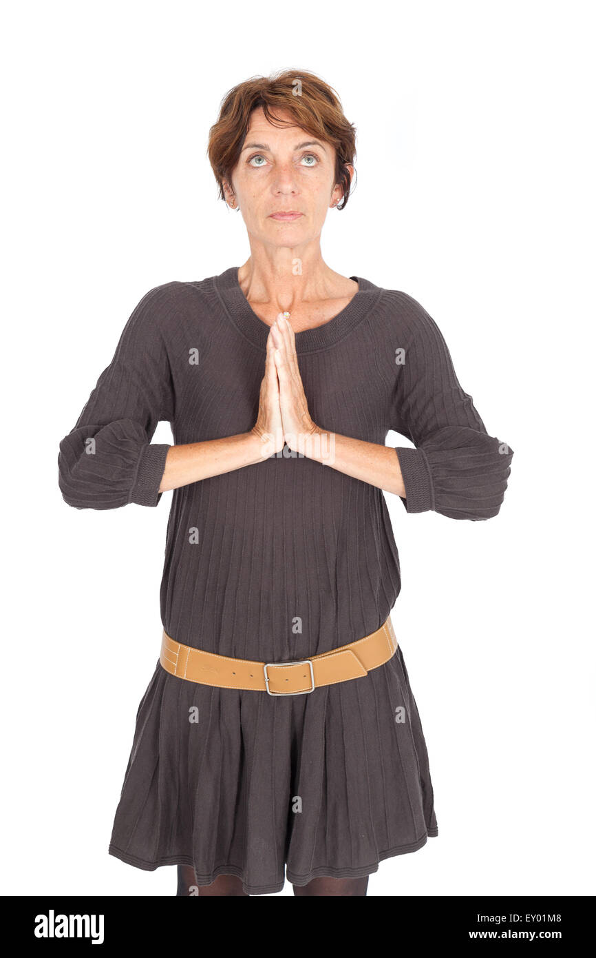 Bella donna facendo espressioni diverse in diversi set di vestiti: pregare Foto Stock