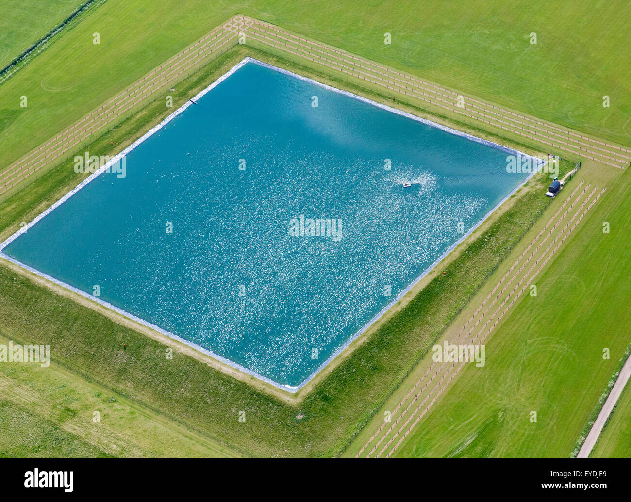 Irrigazione agricola stagno nel Suffolk, Regno Unito Foto Stock