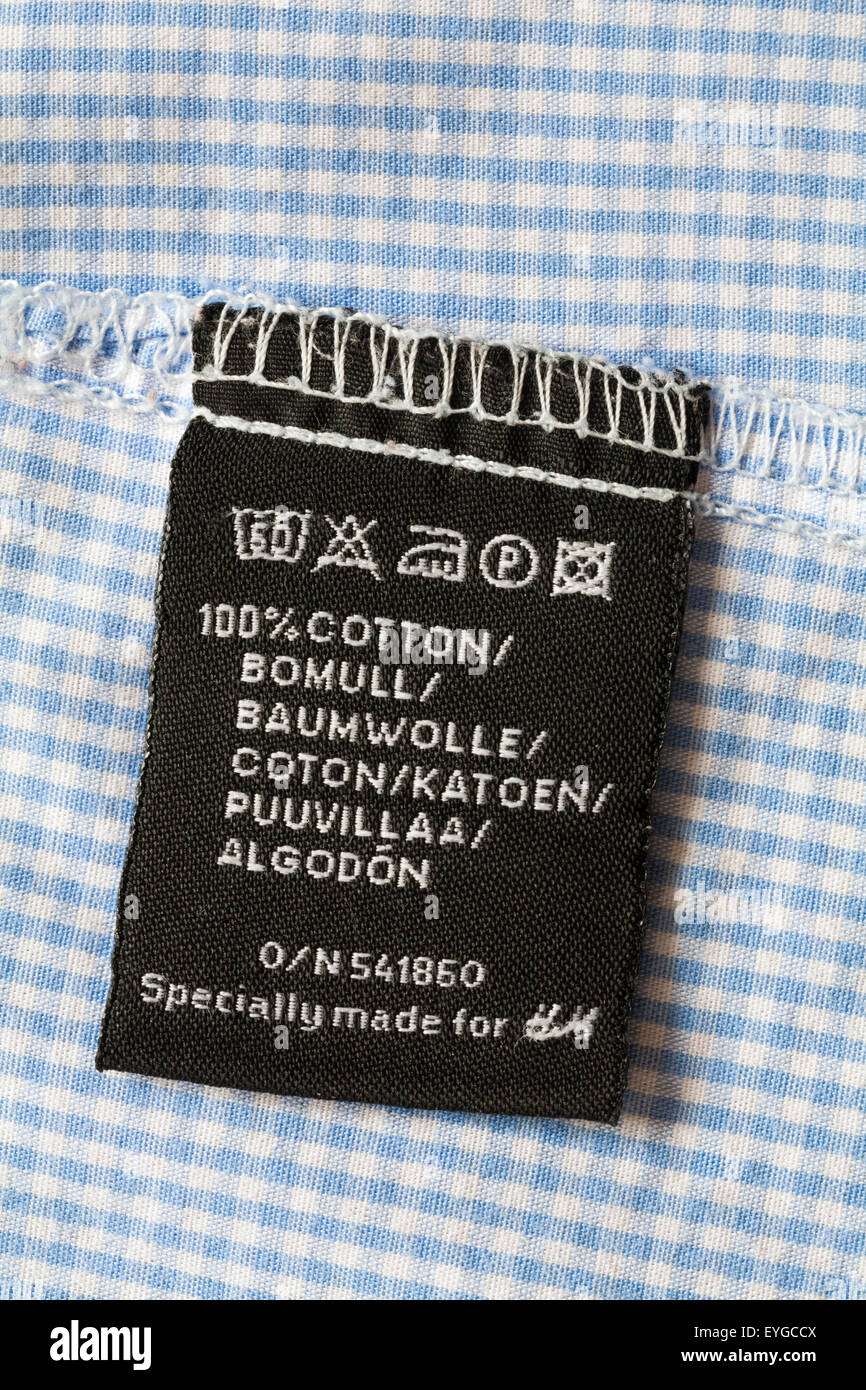 Etichetta di cotone 100% in camicie controllate appositamente realizzate  H&M - simboli e istruzioni per il lavaggio Foto stock - Alamy