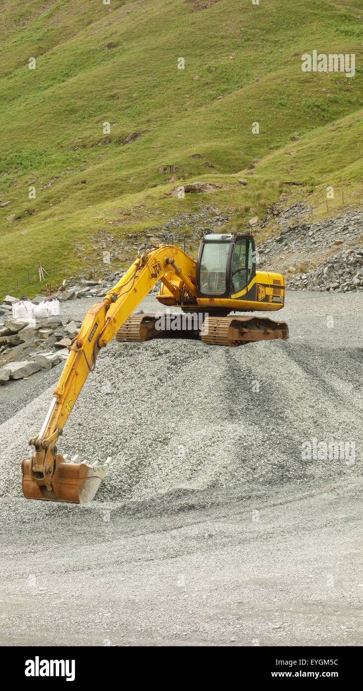 Giallo JCB escavatore Foto Stock