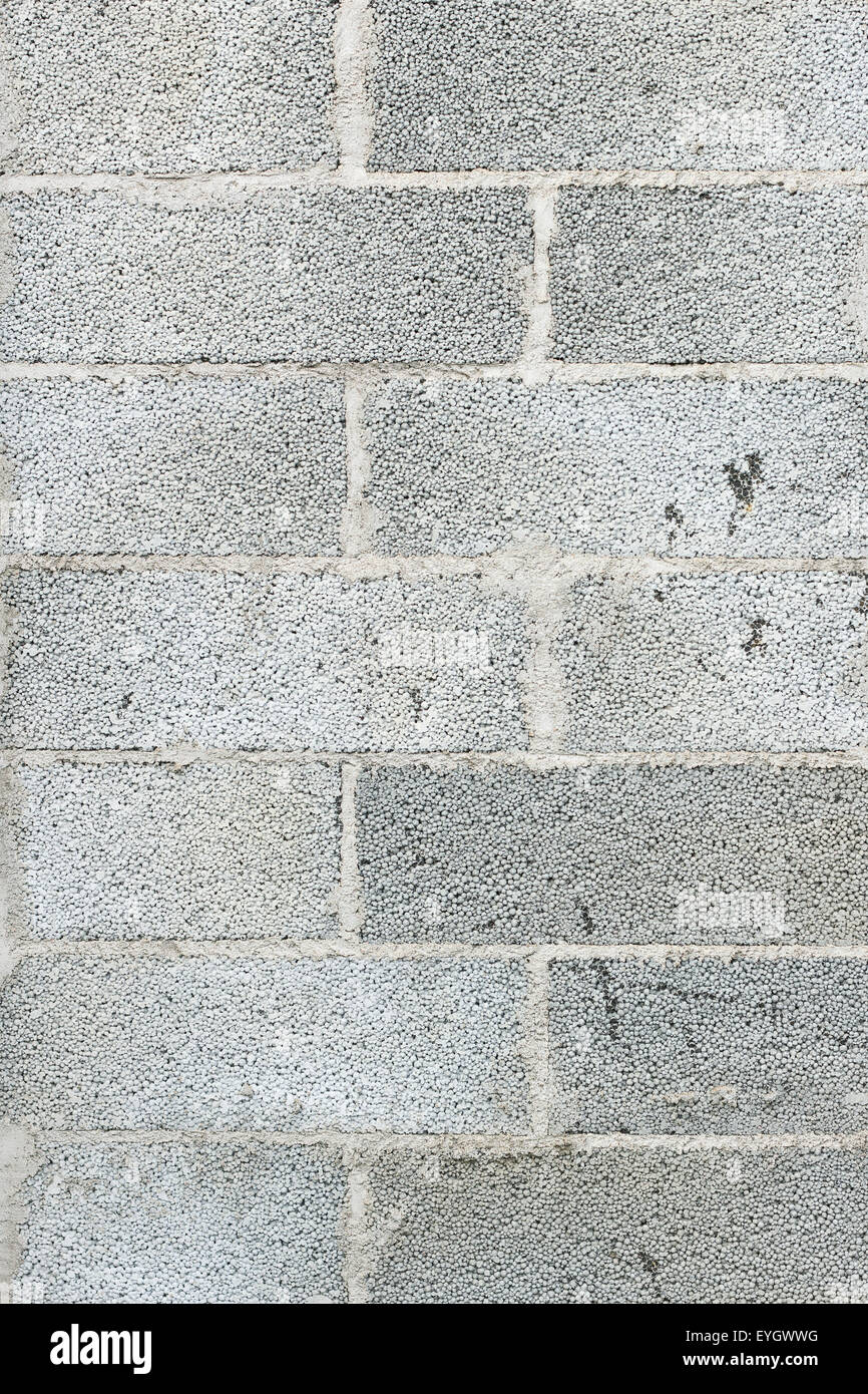 Close-up di grigio di un blocco in calcestruzzo parete sfondo texture Foto Stock