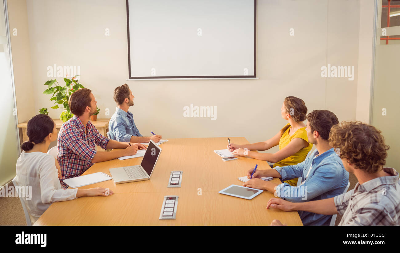 Attento team Aziende a seguito di una presentazione Foto Stock