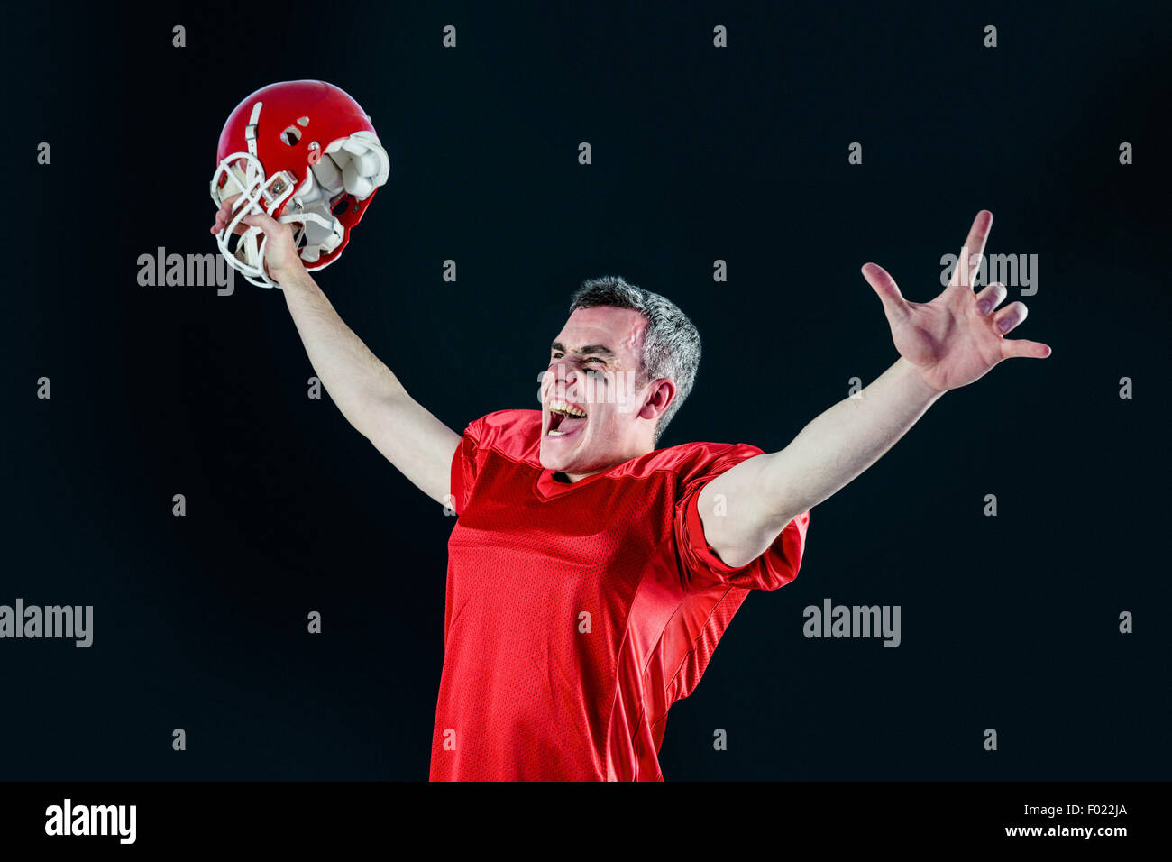 Un trionfo di un giocatore di football americano senza il suo casco Foto Stock