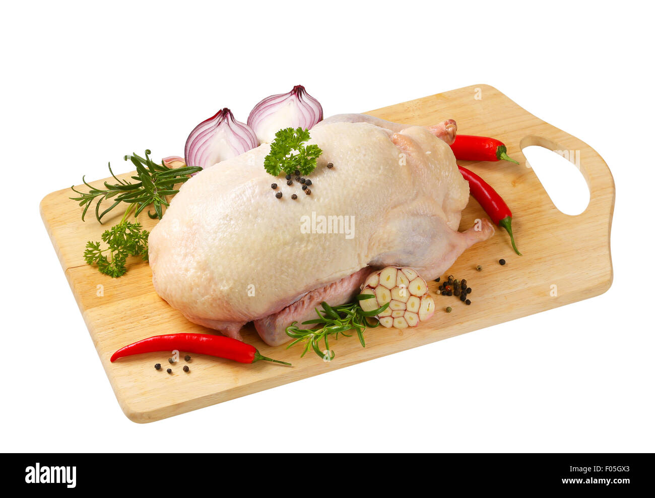 Materie di anatra e di altri ingredienti sul bordo di taglio Foto Stock