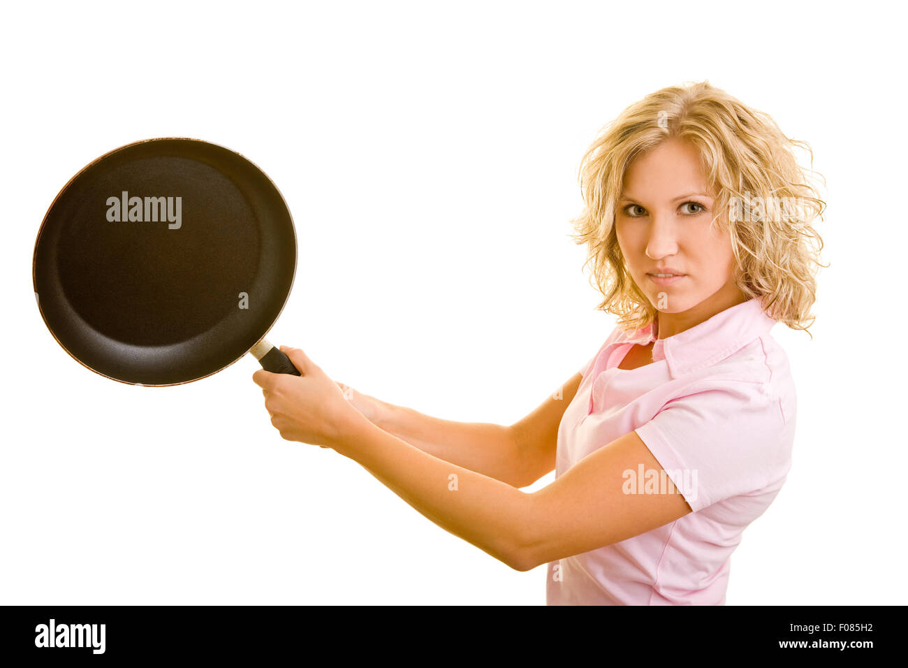 Giovane donna giocando a tennis con una padella Foto Stock