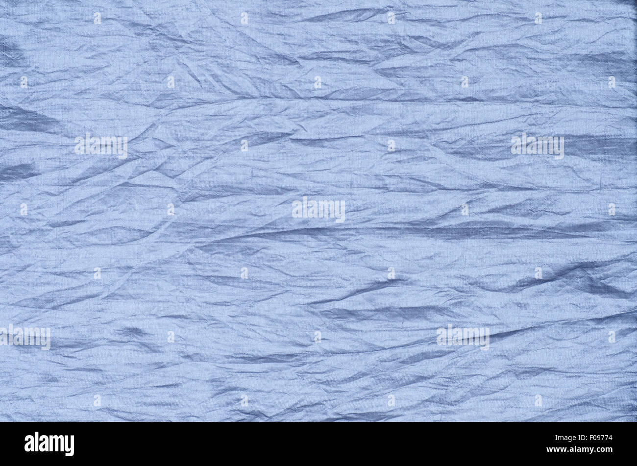 Primo piano di indebolita di seta blu sullo sfondo di texture Foto Stock