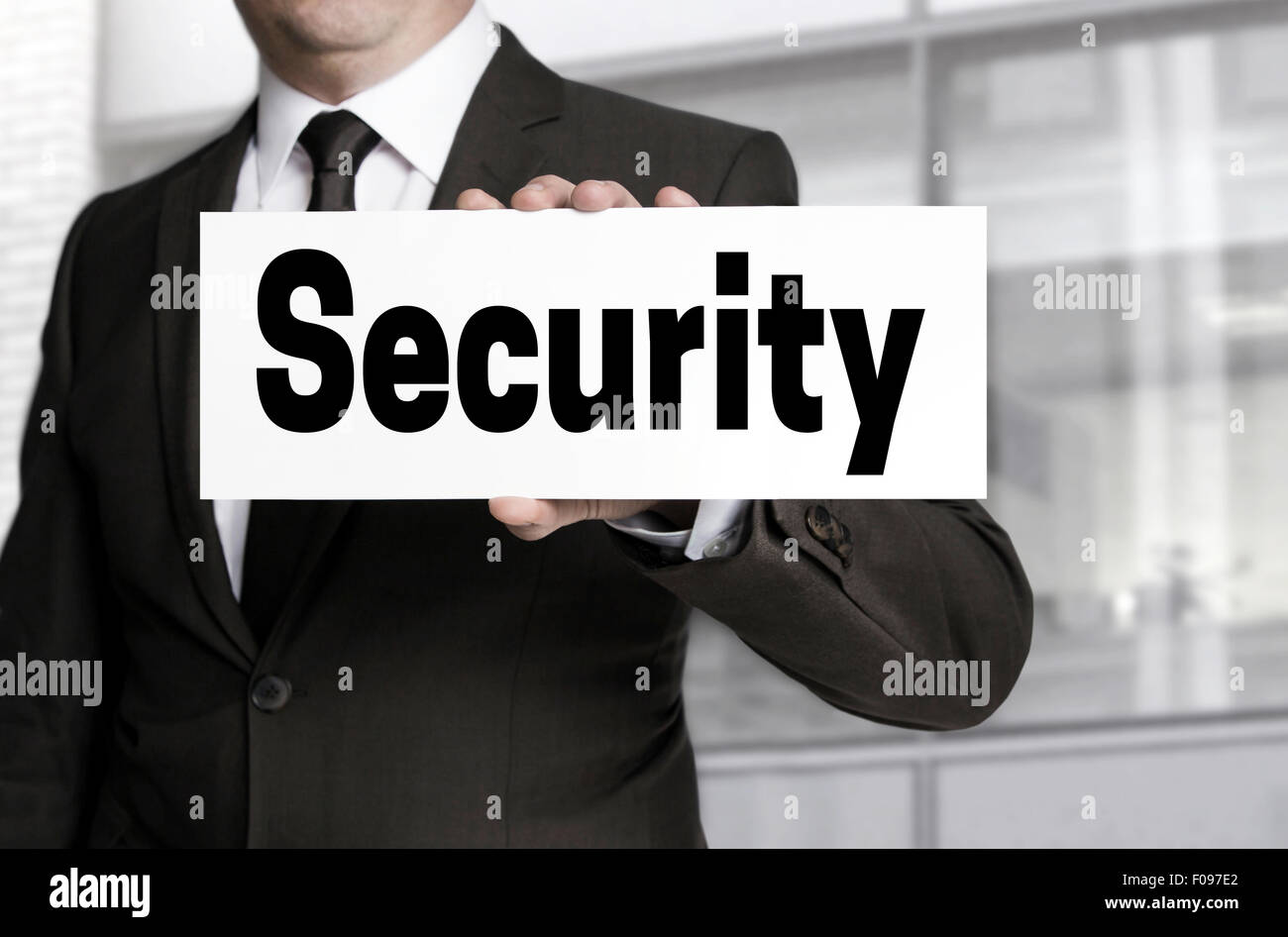 Segno di protezione è tenuto da parte dell'imprenditore. Foto Stock