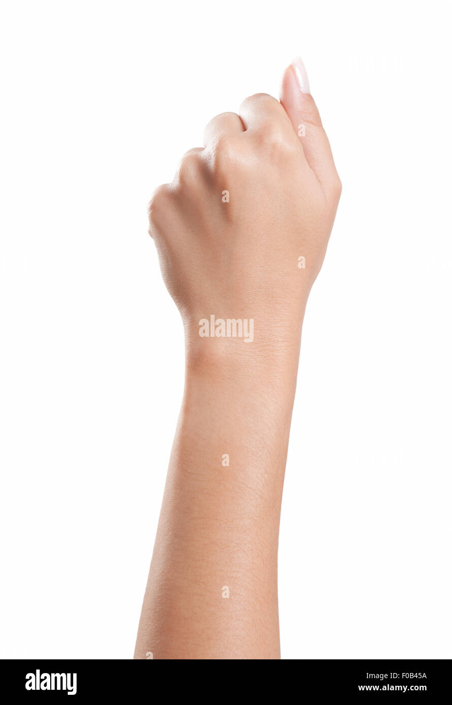 Donna serrata a mano in un pugno con belle unghie curati, sfondo bianco, isolato Foto Stock