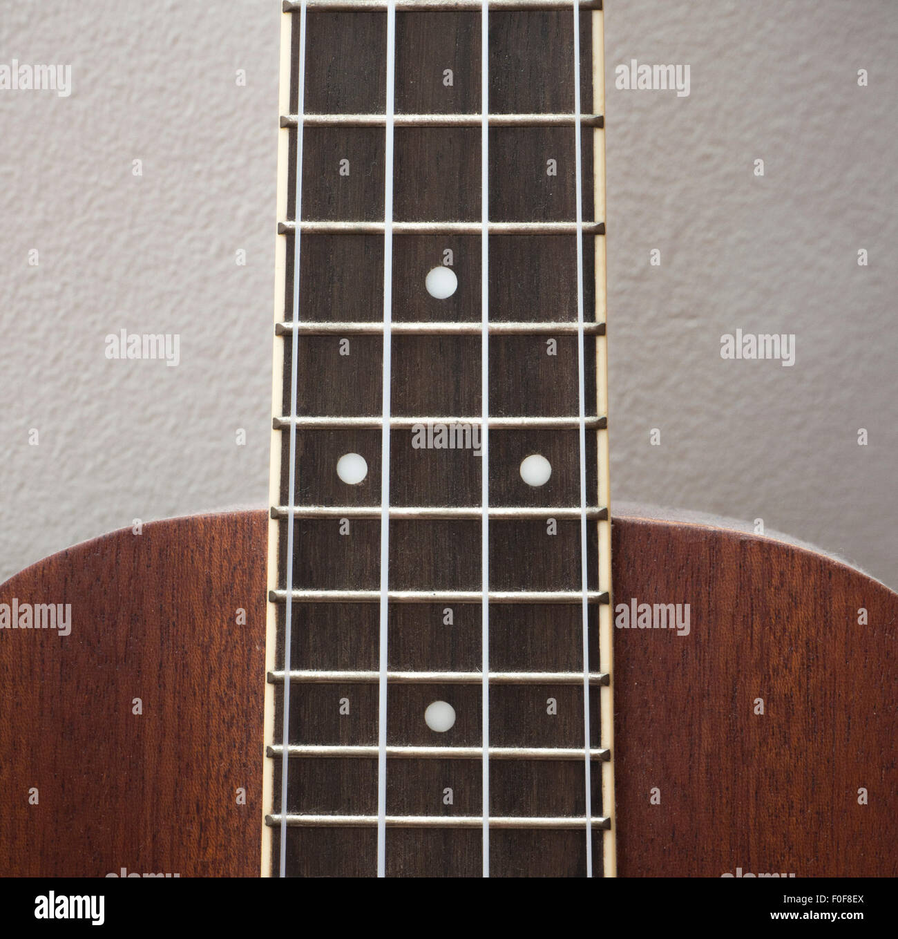 Le stringhe di Ukulele e corpo Foto Stock