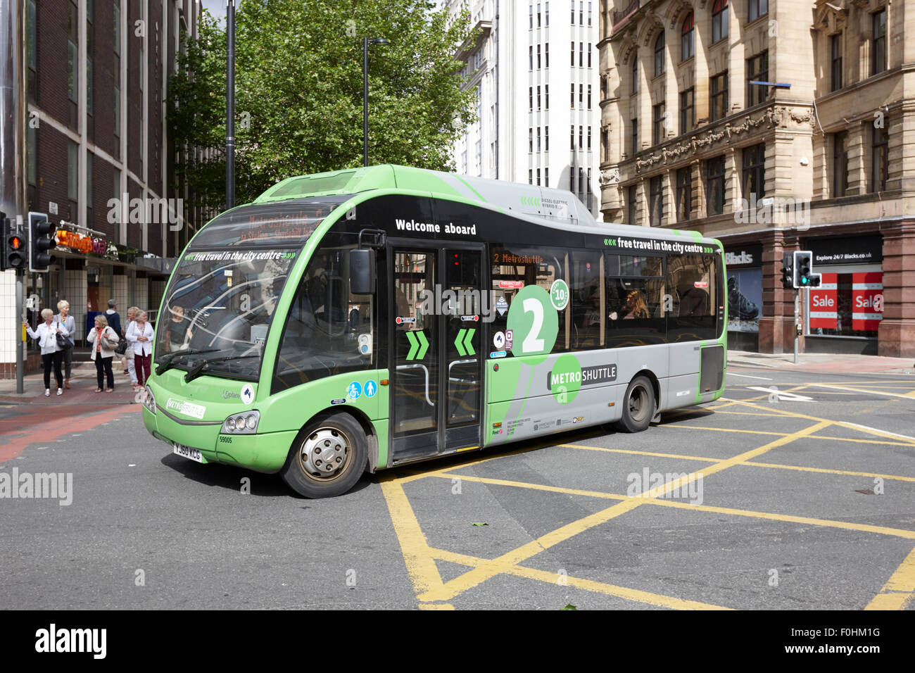 Metro libero bus navetta percorso verde due nel centro della città di Manchester Inghilterra England Regno Unito Foto Stock