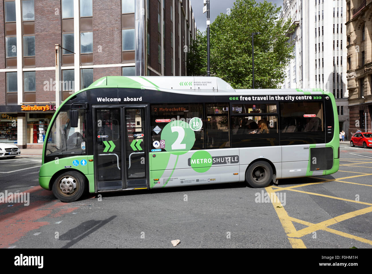 Metro libero bus navetta percorso verde due nel centro della città di Manchester Inghilterra England Regno Unito Foto Stock