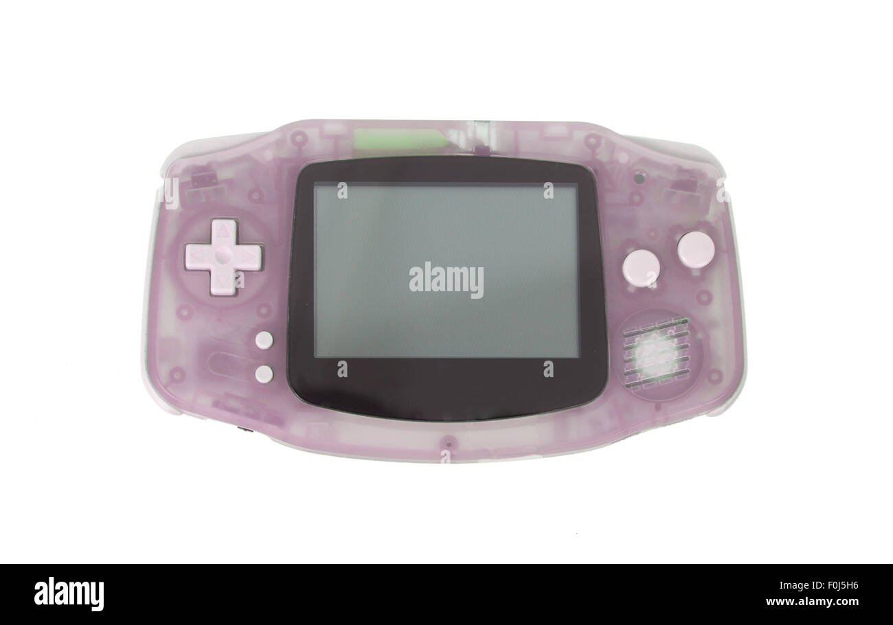 Old Dirty console di gioco portatili con un piccolo schermo, isolato su bianco - rosa Foto Stock