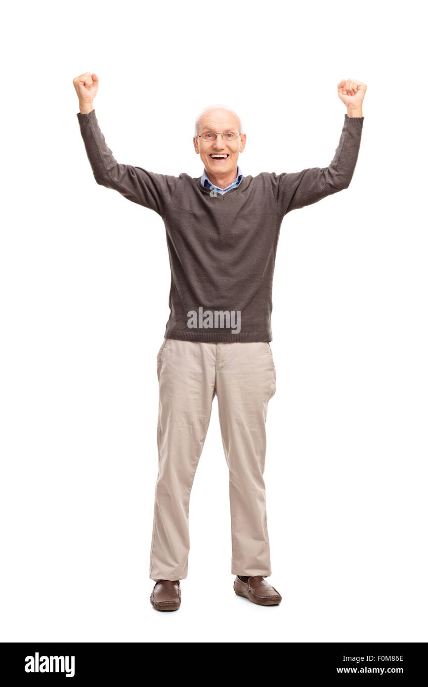 A piena lunghezza Ritratto di un gioioso alti gesti felicità con entrambe le mani in aria isolata su sfondo bianco Foto Stock