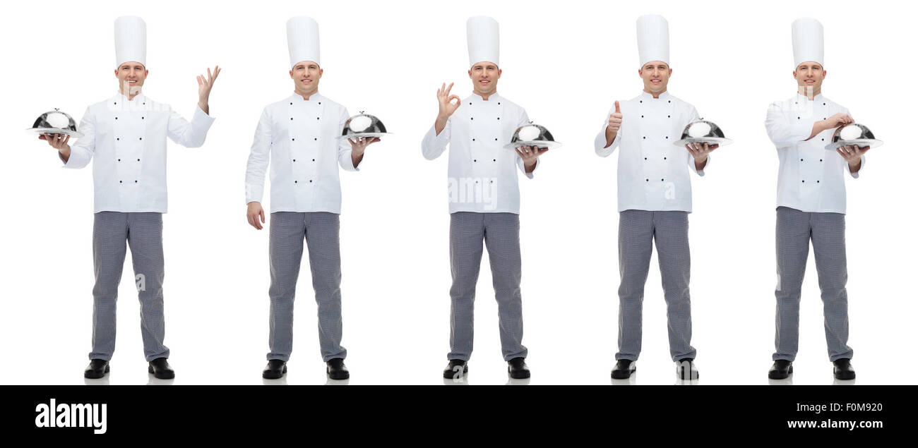 Maschio felice chef di cucina azienda cloche Foto Stock