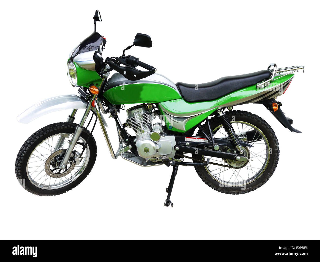 Piccolo motociclo verde isolato su uno sfondo bianco Foto Stock