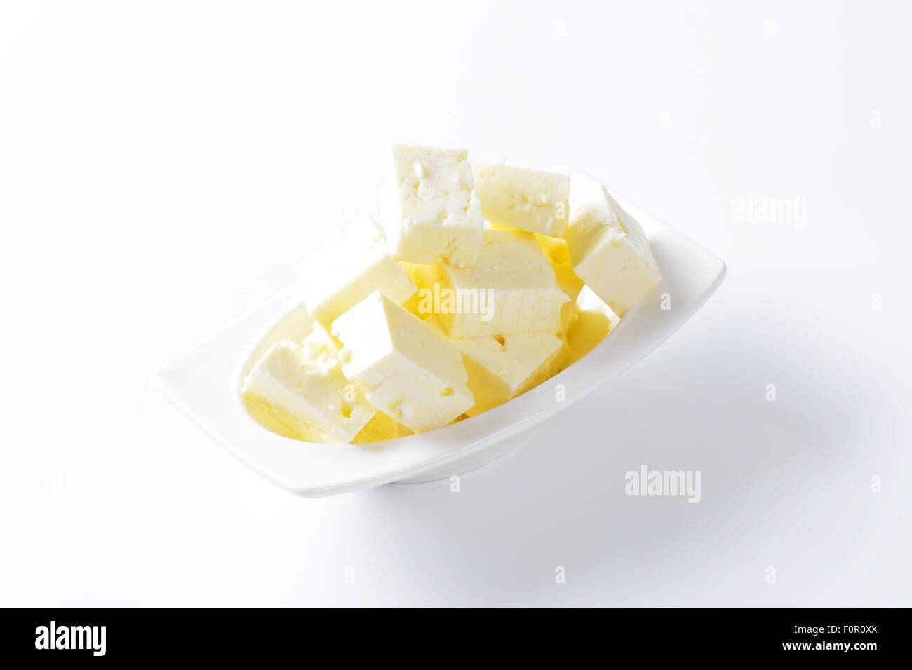 Tazza di feta formaggio tagliato a cubetti Foto Stock