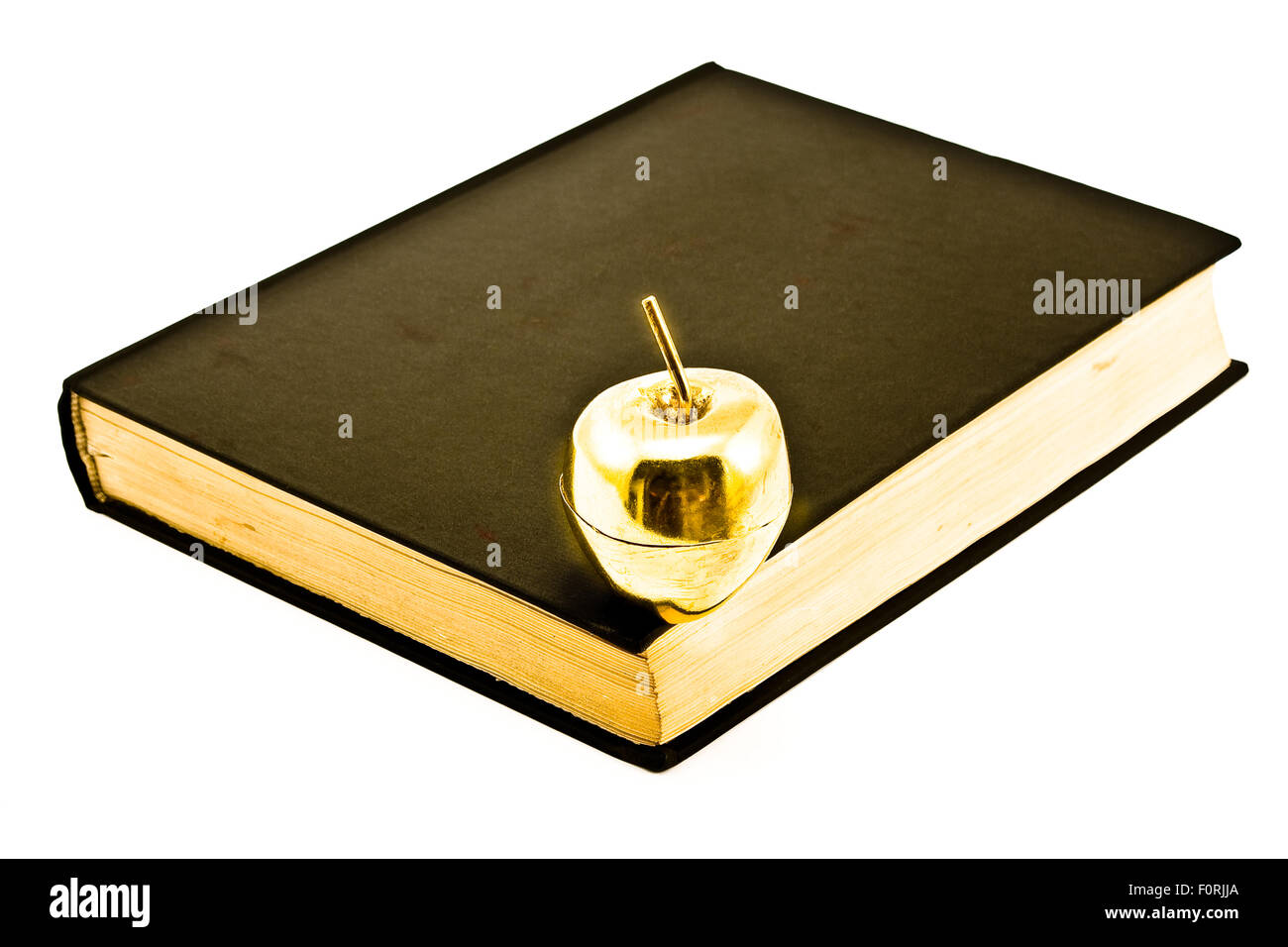 Golden Apple sul vecchio Libro isolato su bianco Foto Stock