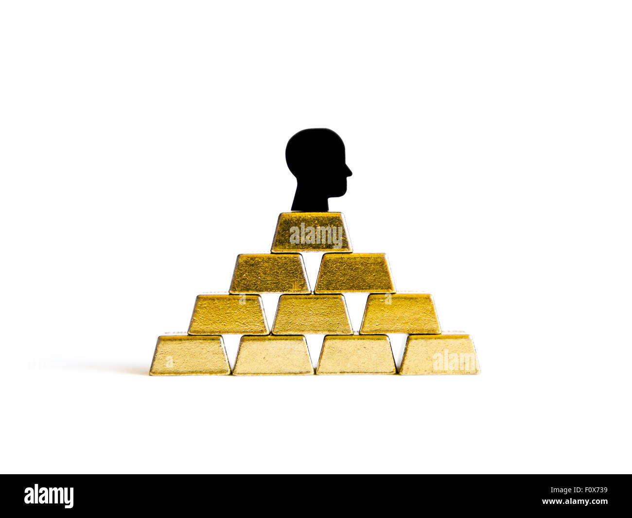 Golden mattoni: ricchezza concettualizzazione isolato Foto Stock
