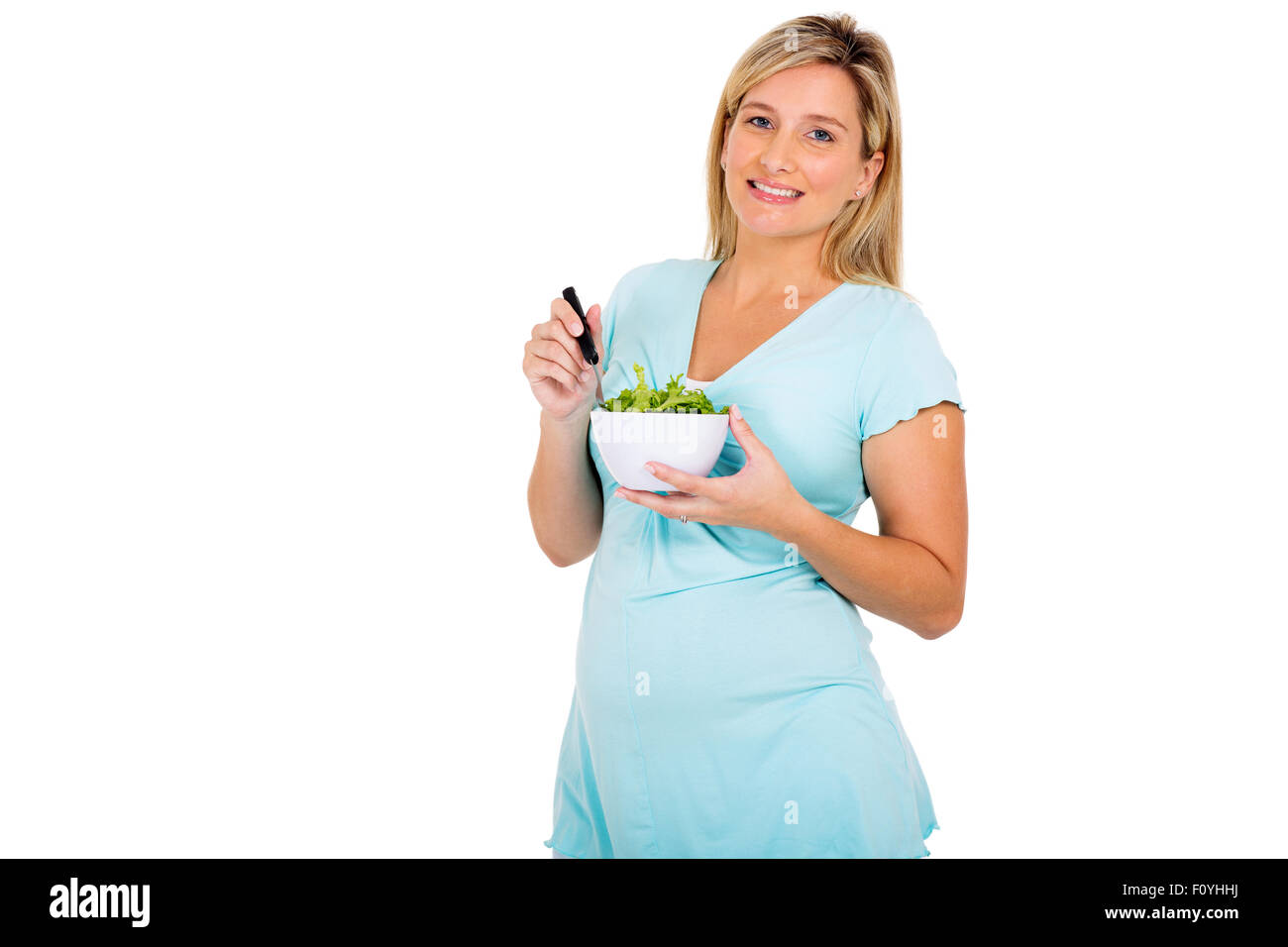 Ritratto di carino donna incinta insalata mangiare Foto Stock