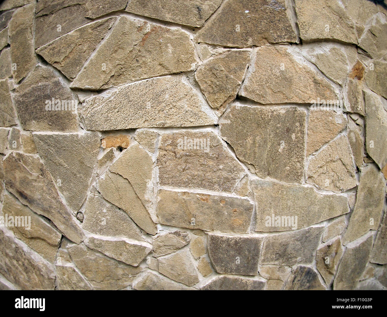 La texture delle pareti della grande ruvide pietre di colore grigio Foto Stock