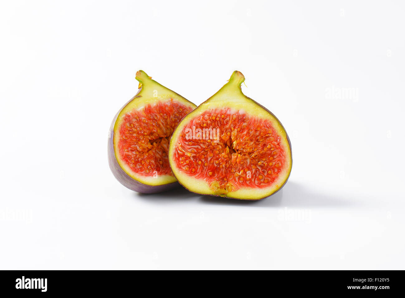 La figura fresca frutta tagliata a metà Foto Stock