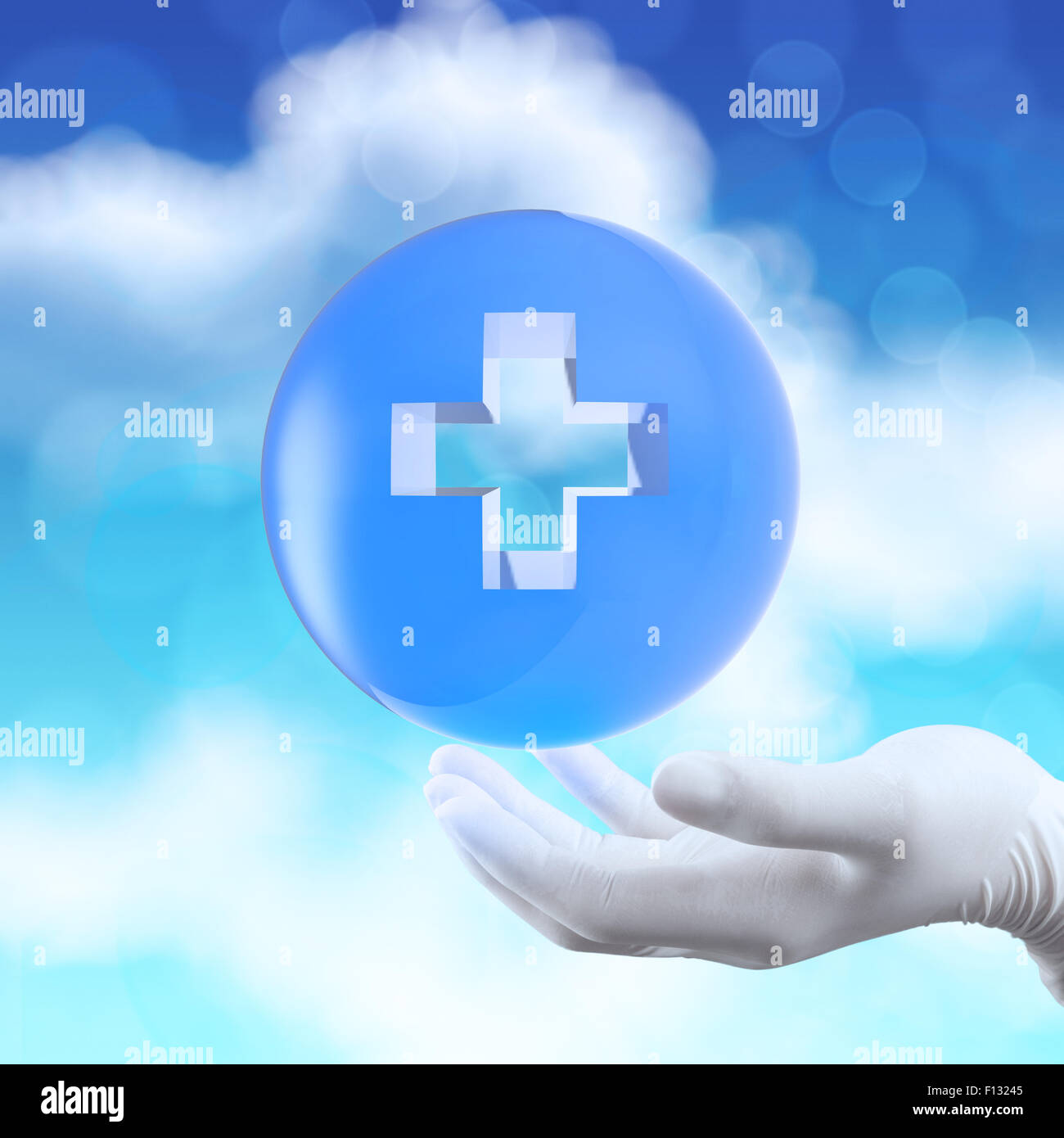 Mano medica con globo selezionare sul primo segno di aiuto come concetto Foto Stock