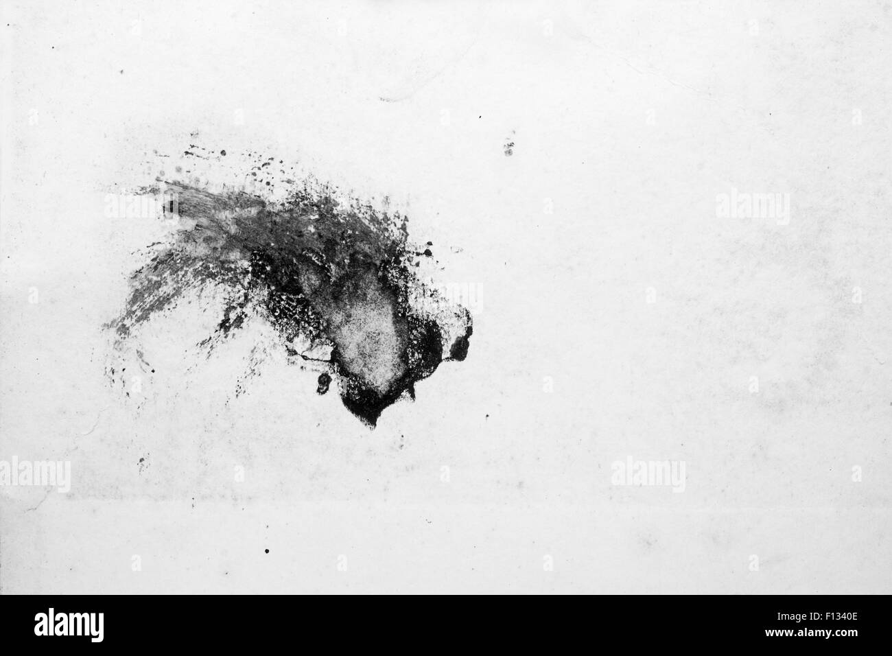 Elemento di nero le macchie di inchiostro su carta bianca Foto Stock