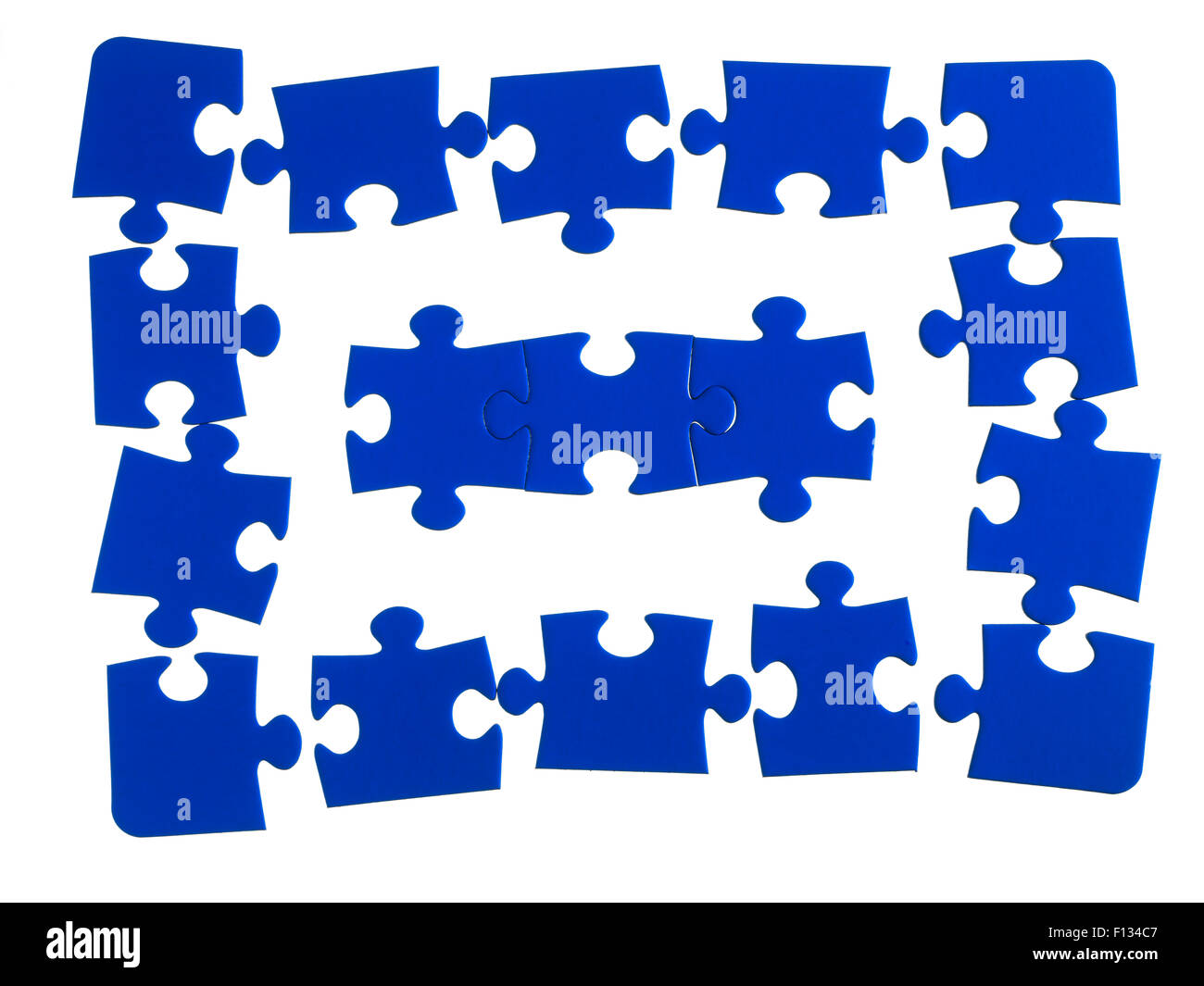 Jigsaw pezzi su uno sfondo bianco Foto Stock