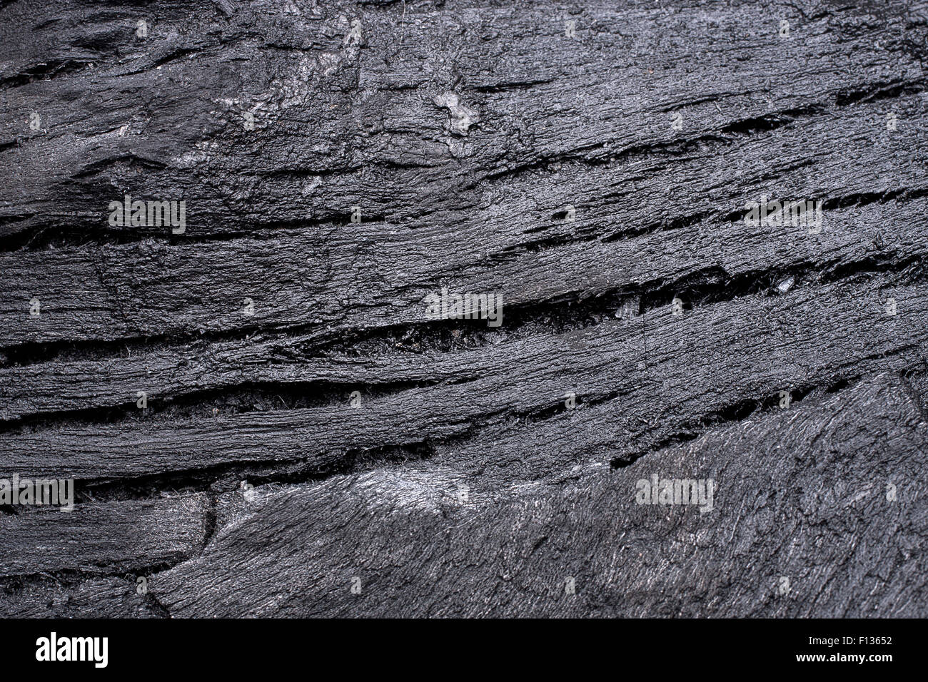Dettagli e texture di nero di carbone di legno Foto Stock