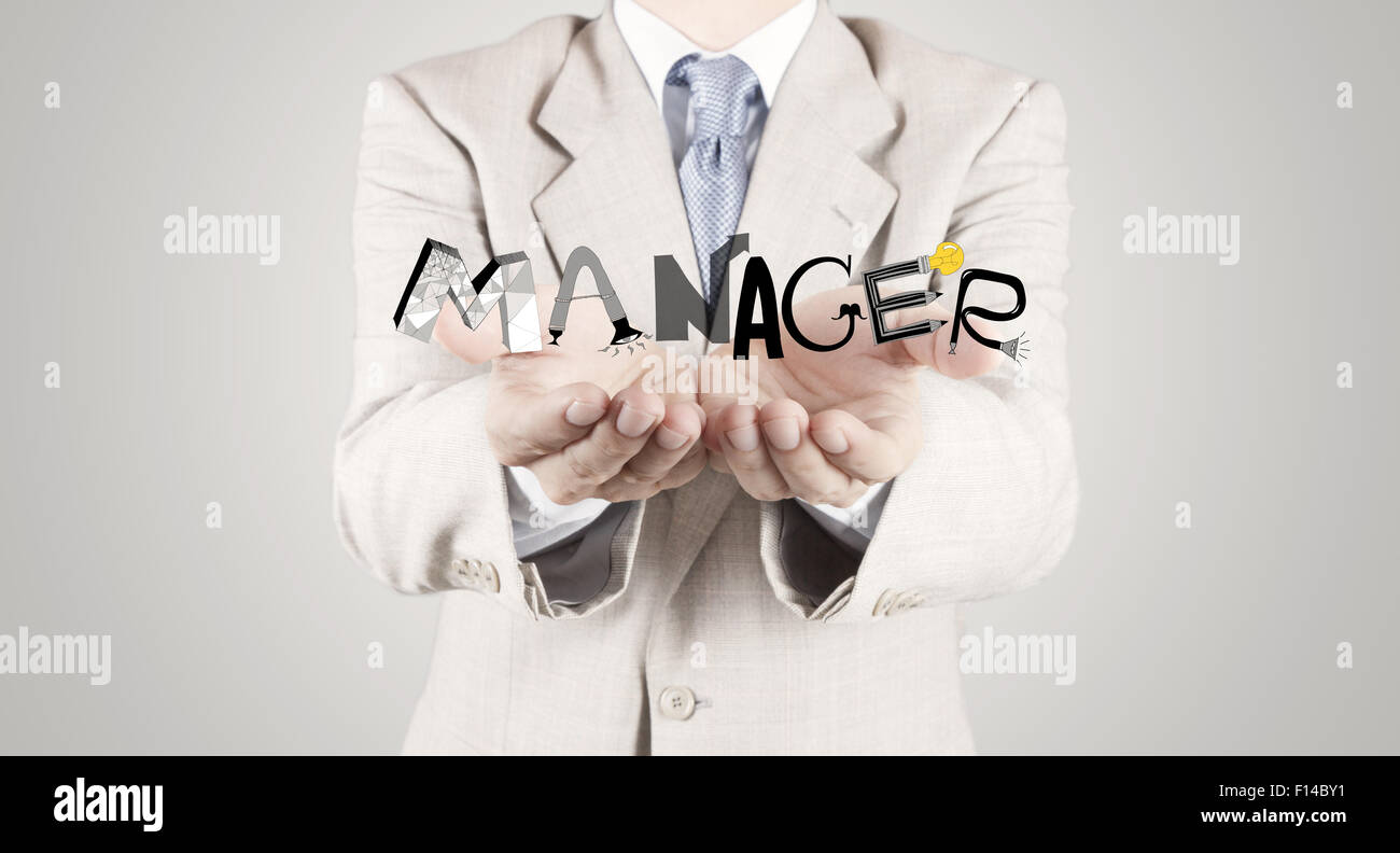 Imprenditore mano mostra design graphic word manager come concetto Foto Stock