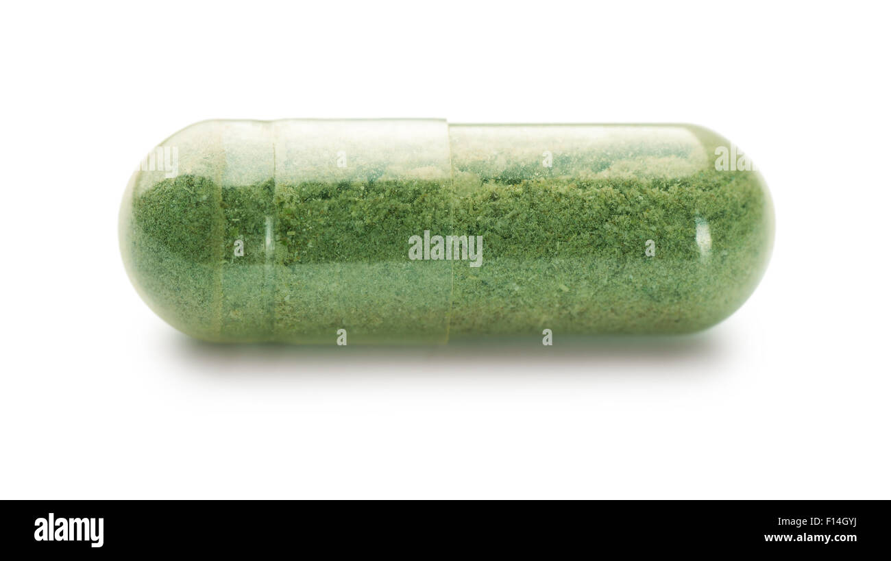 Singola capsula di erbe isolato su bianco Foto Stock
