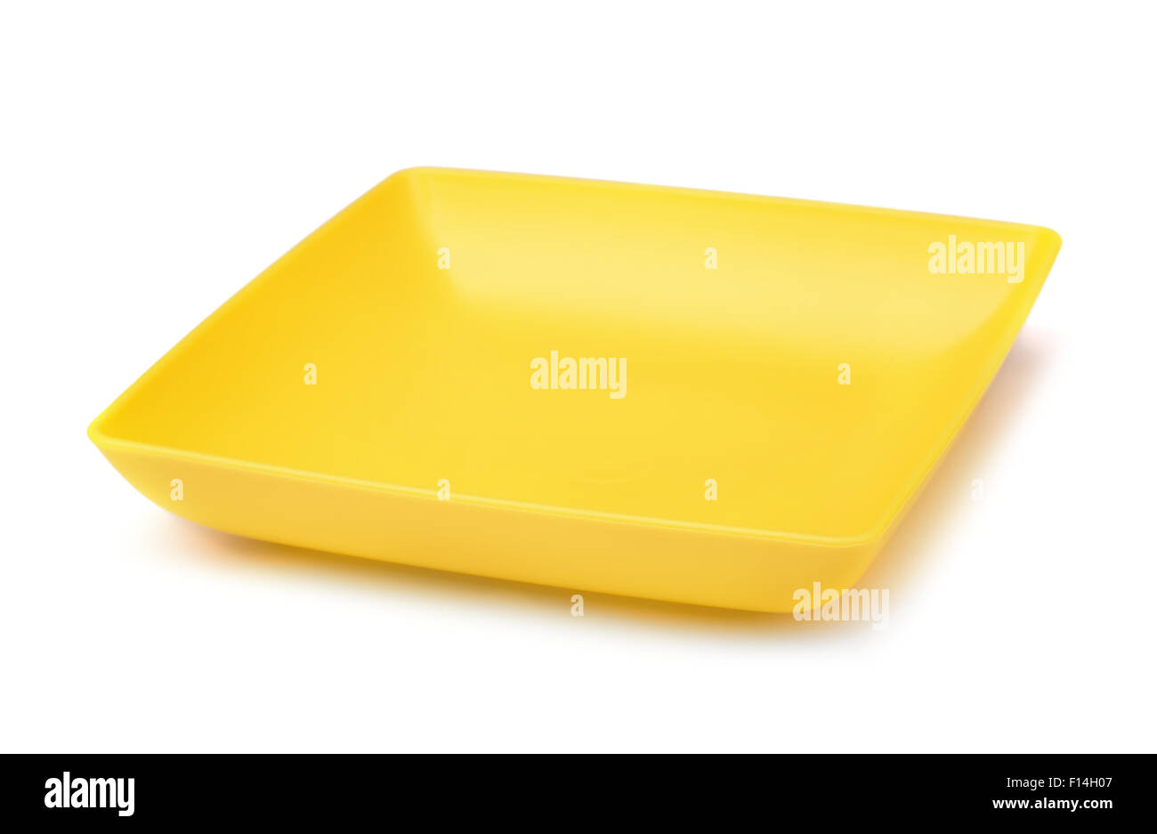 Quadrato giallo piastra in plastica isolato su bianco Foto Stock