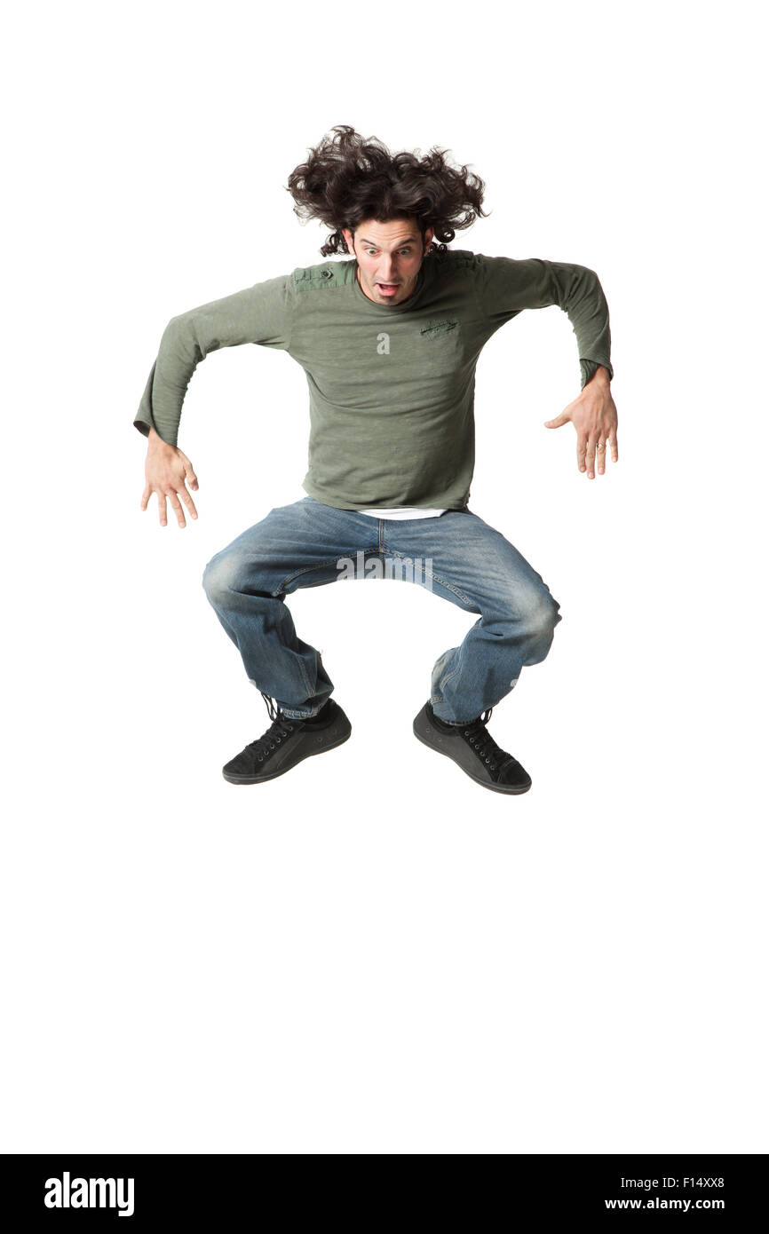 L'uomo jumping a mezz aria Foto Stock