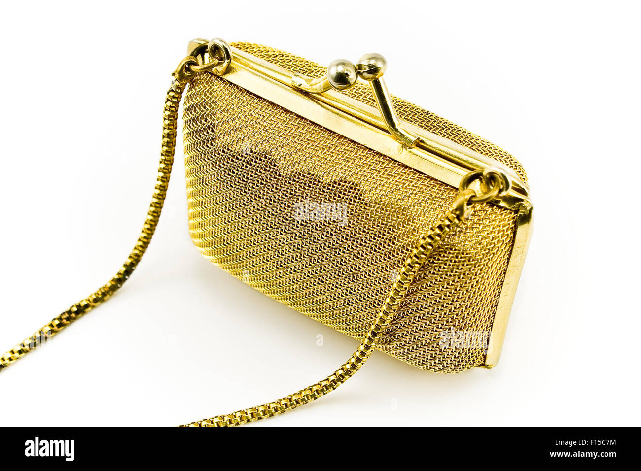 Oro metallizzato purse isolato su bianco Foto Stock