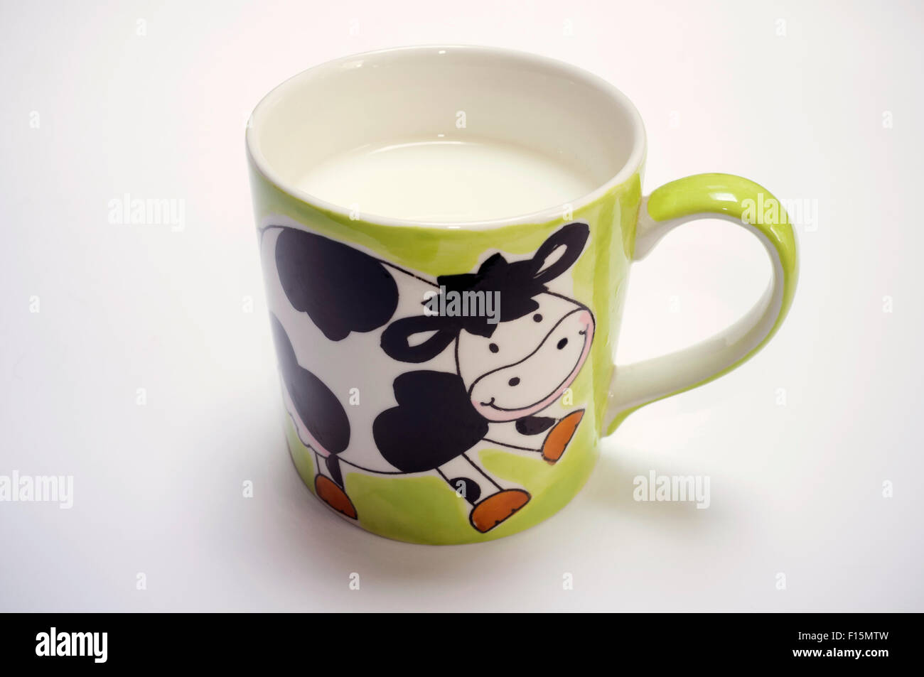 Latte in tazza mucca Foto Stock