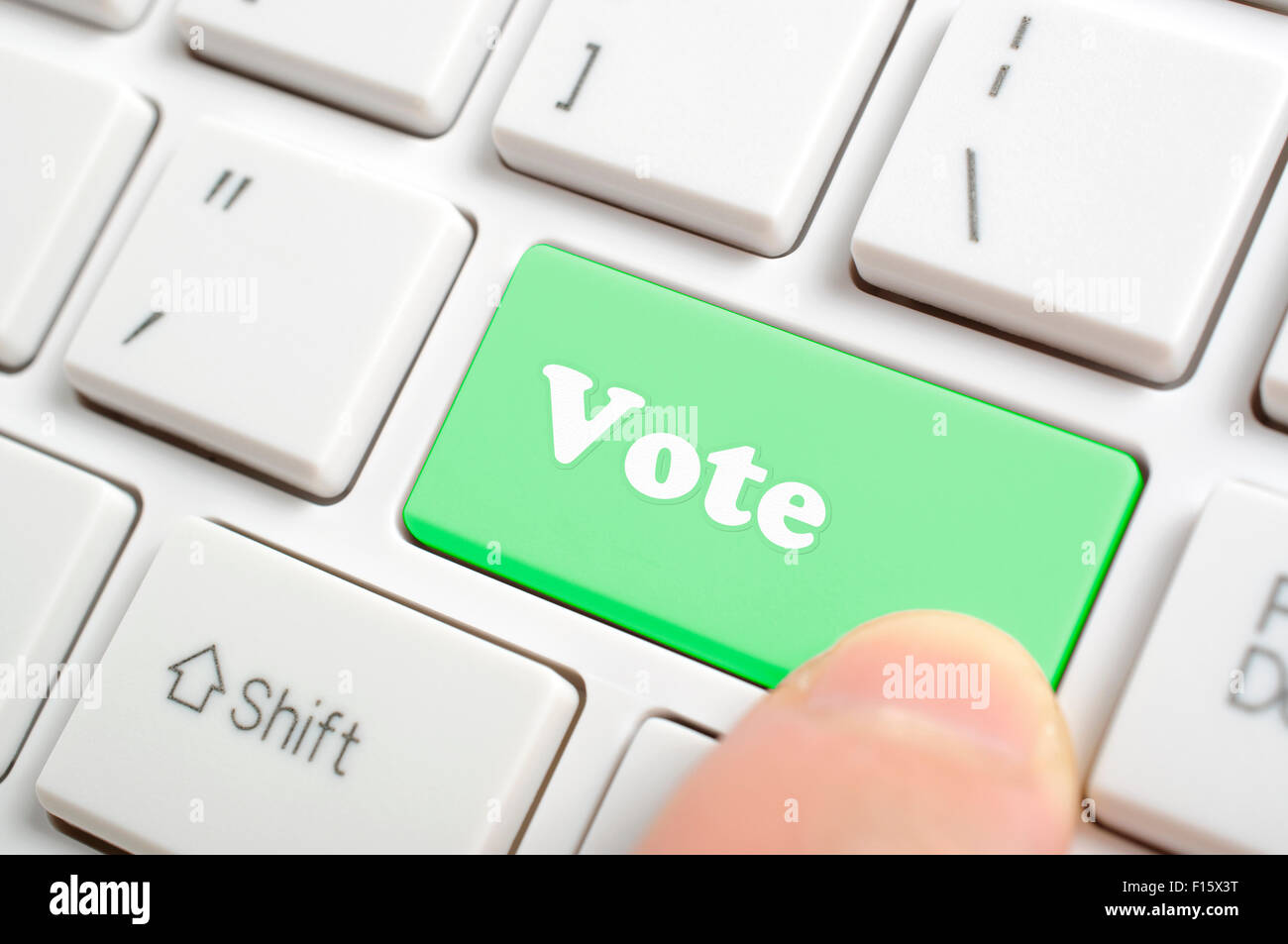 Premendo green vota tasto sulla tastiera Foto Stock