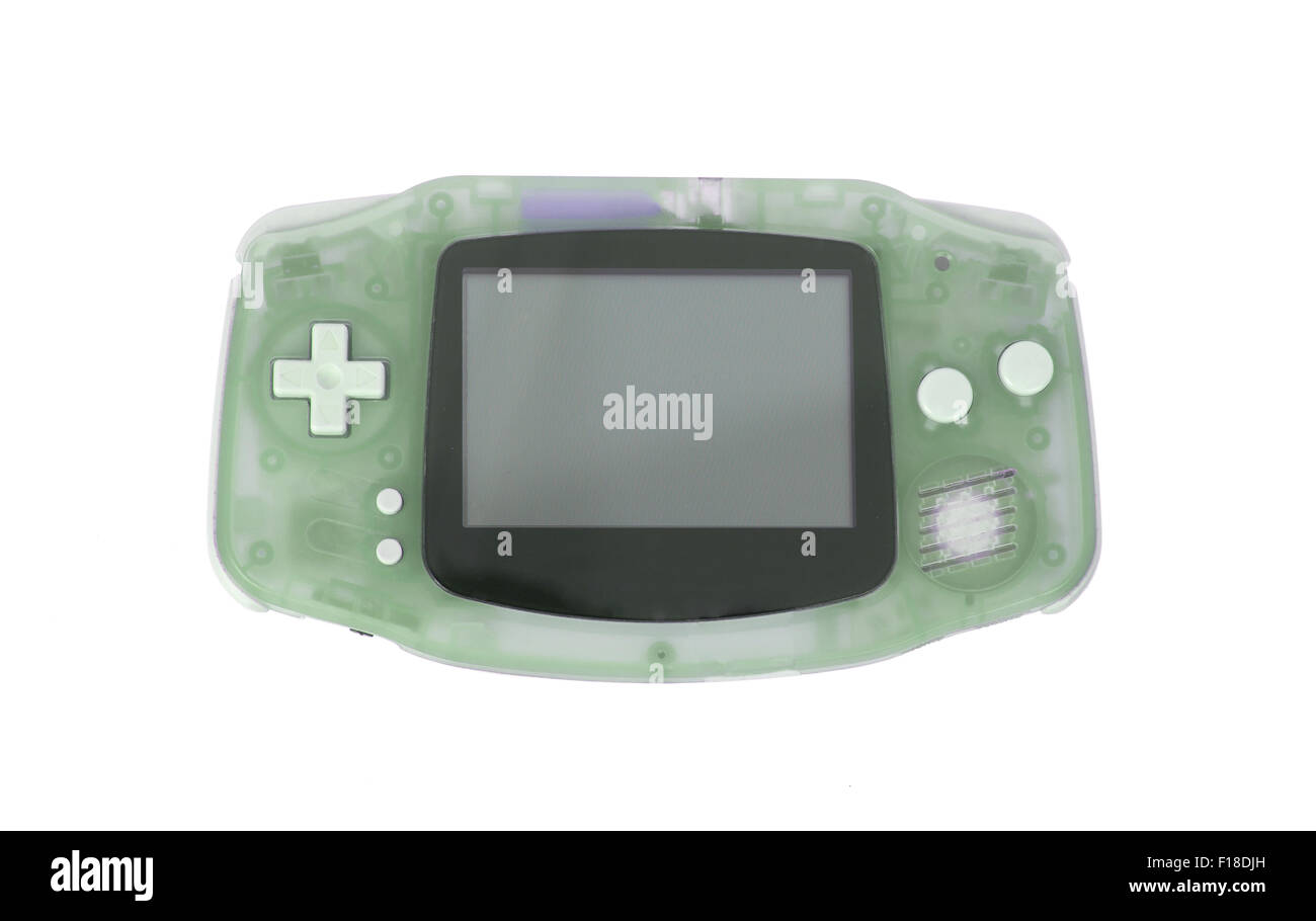 Old Dirty console di gioco portatili con un piccolo schermo, isolato su bianco - verde Foto Stock
